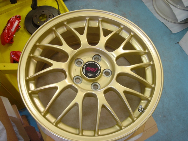 RI7007 - Limited edition STI gold rims with carbon fiber center caps.