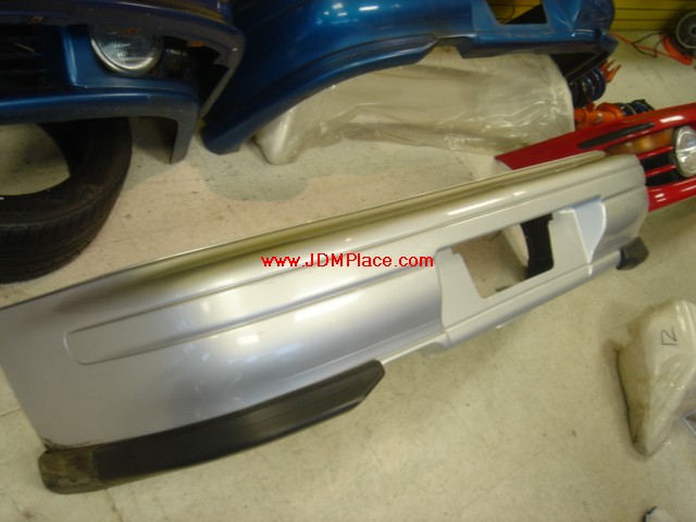 BD21006 - JDM STI Version 4 rear bumper with spats fits 93-01 Imprezas, in dark blue.