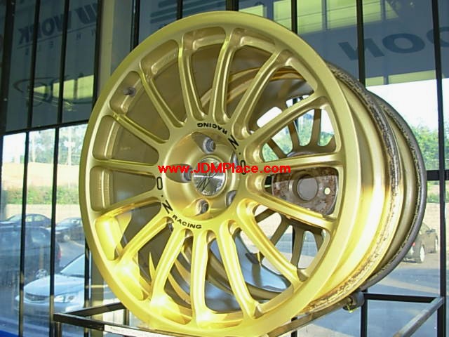 RI27007 - Rare JDM OZ Racing Superturismo EVO (known as Super-T), made for GDB STI Impreza with brembo brakes, 17x8 +43 5x100 offset in gold colour.