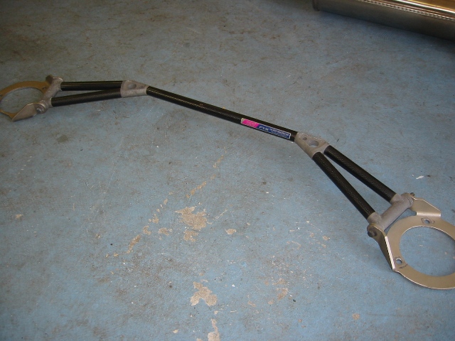 BR10004 - JDM Impreza Ver4-6 carbon fiber front strut tower bar for 93-01 Impreza and 96-04 Legacy, 97-01 Foresters.
 
