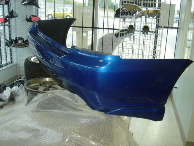 BD190006 - Rare JDM BL Legacy Spec B sedan rear bumper with aero splash guards.